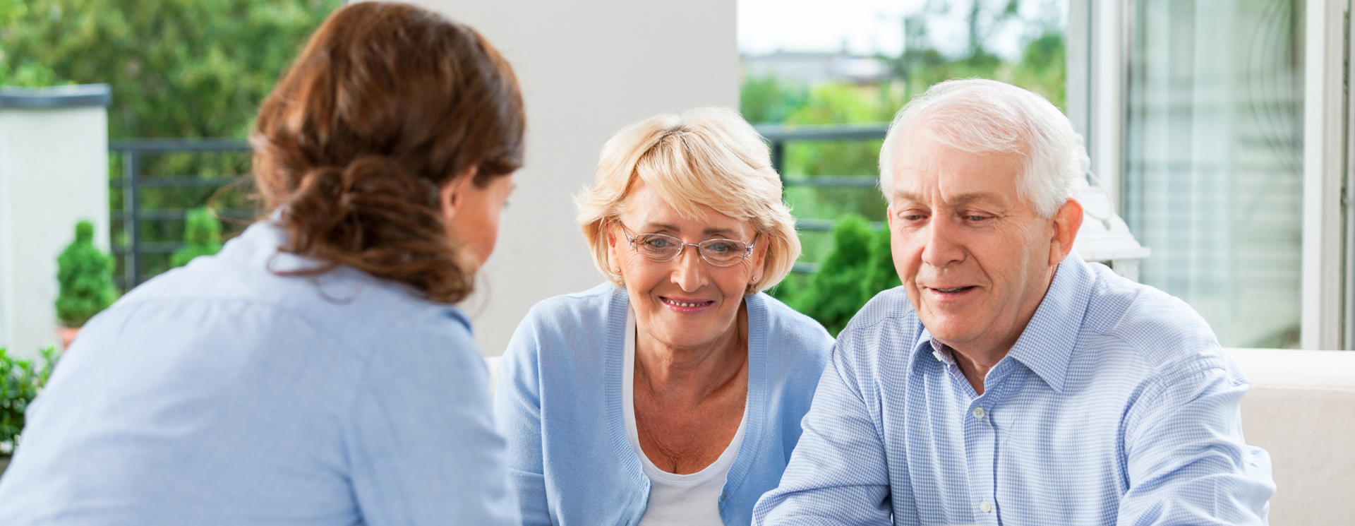 elderly couple working with an insurance agent